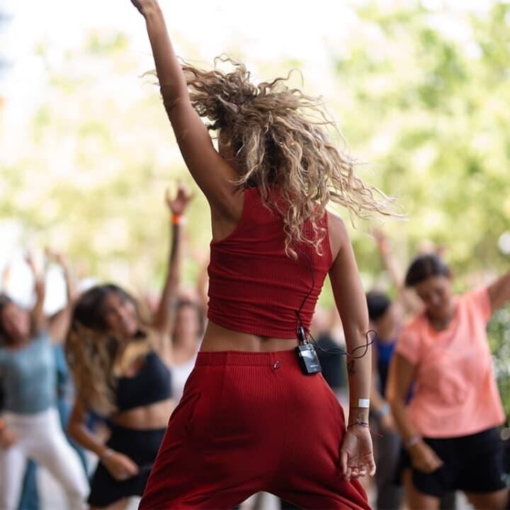 Energetic outdoor group dance fitness session